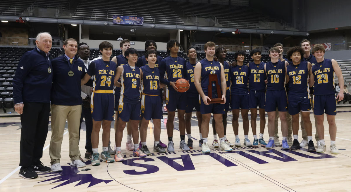 The Lions won the 84th Annual Dallas ISD Holiday Hoops Tournament with a 54-50 overtime victory over Panther Creek Dec. 28 at Ellis Davis Fieldhouse.